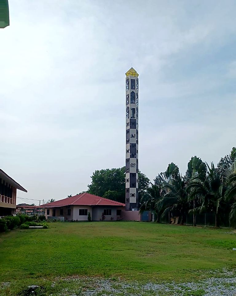 Green lattice tower finished as a minaret